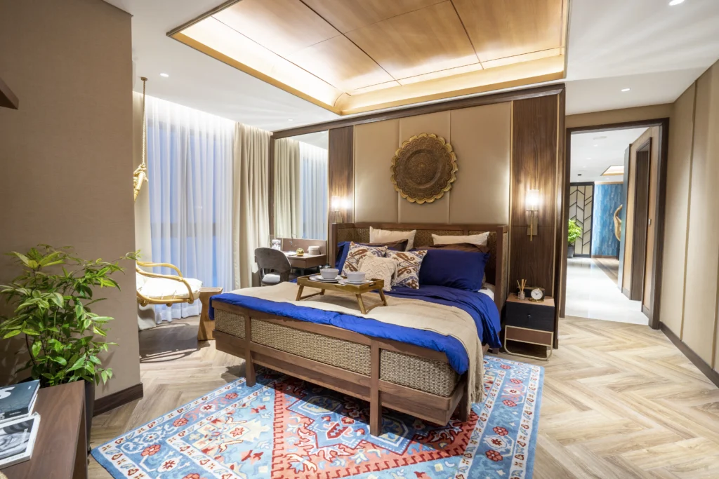 Kamar tidur utama di show unit VIVRE dengan desain elegan dan tenang